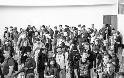 Conference attendees gathered in a crowded session room